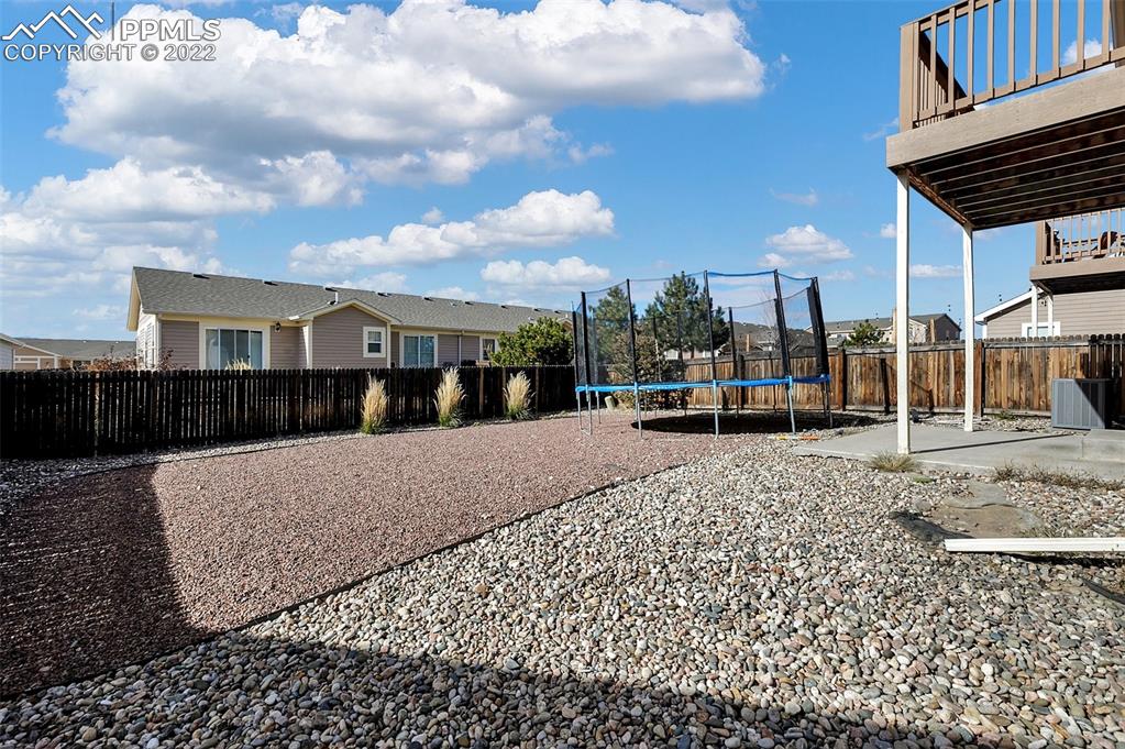 6570 Gelbvieh Road Peyton, CO 80831 - Photo 36 of 38 a view of a house with a patio