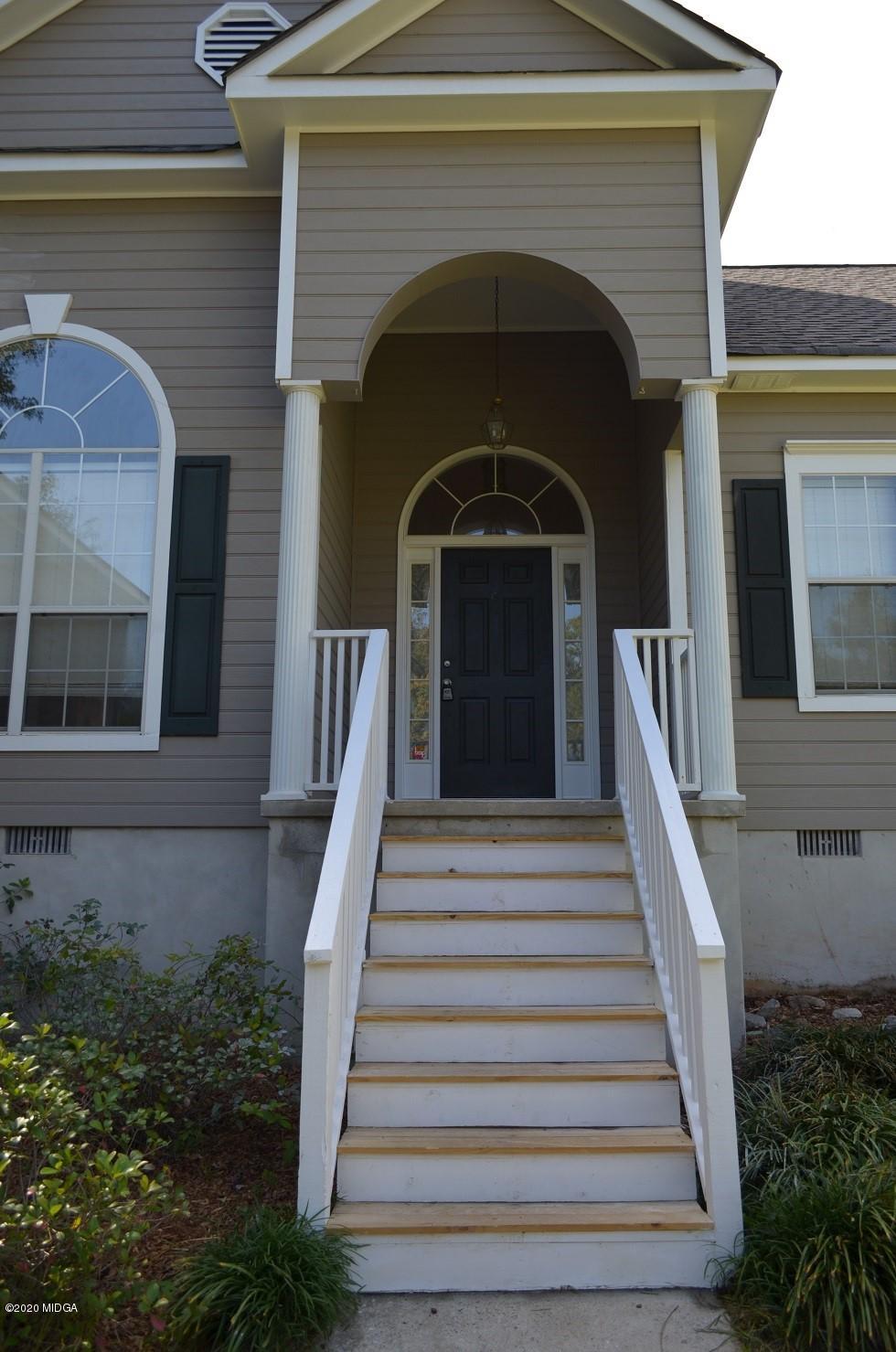 253 Chadwick Circle Macon, GA 31210 - Photo 2 of 19 a front view of a house with a yard