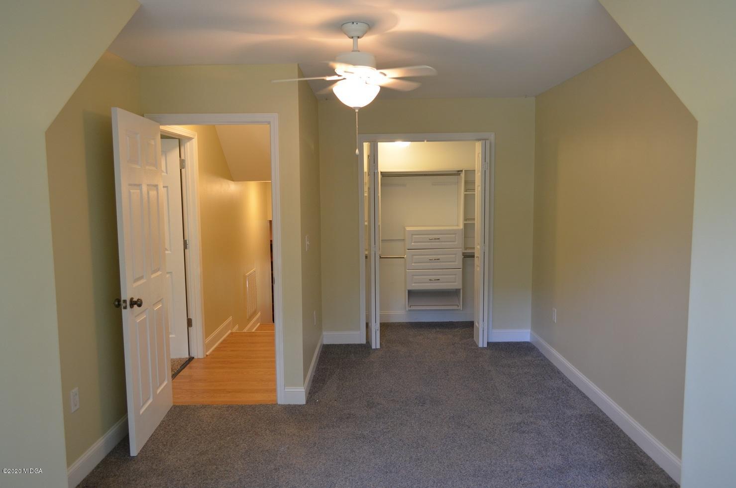 253 Chadwick Circle Macon, GA 31210 - Photo 15 of 19 a view of a room with an empty space and a ceiling fan