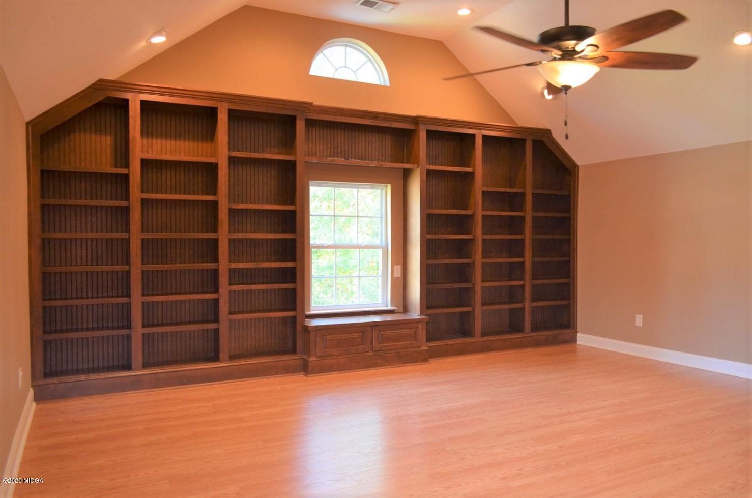253 Chadwick Circle Macon, GA 31210 - Photo 17 of 19 a view of an empty room with a fireplace and a window