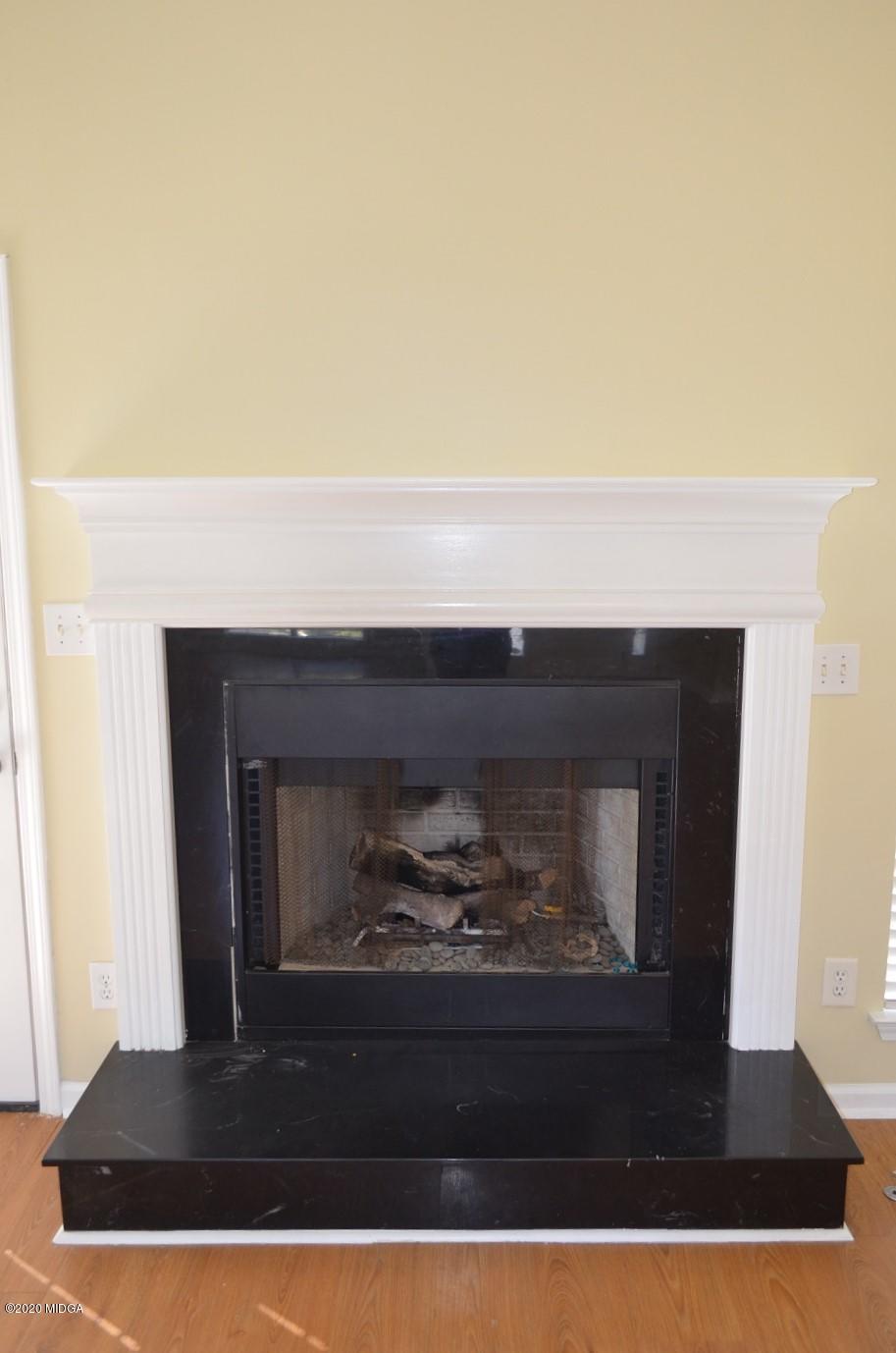 253 Chadwick Circle Macon, GA 31210 - Photo 5 of 19 a closeup of a fireplace