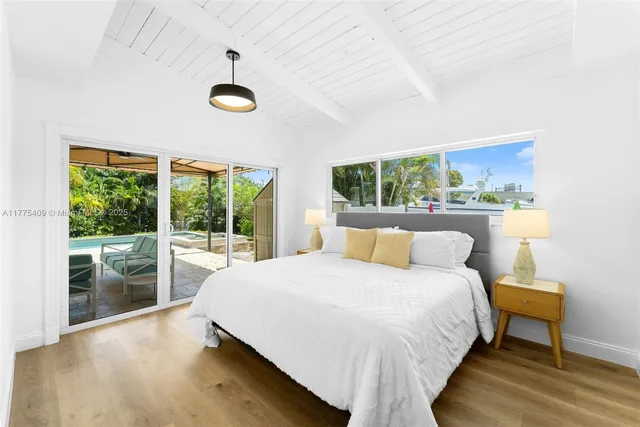 a bedroom with a bed and a table