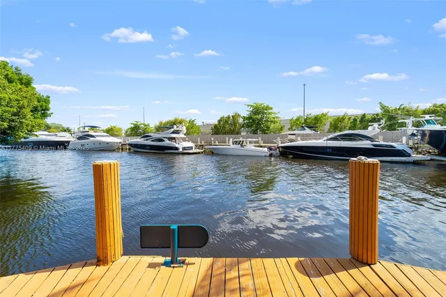 a swimming pool with outdoor seating and yard