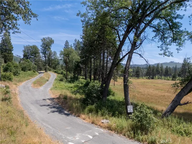 a lake view with a wooden fence