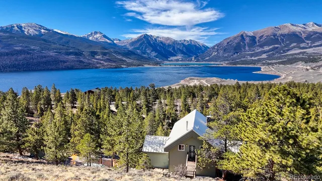 a view of house with a yard
