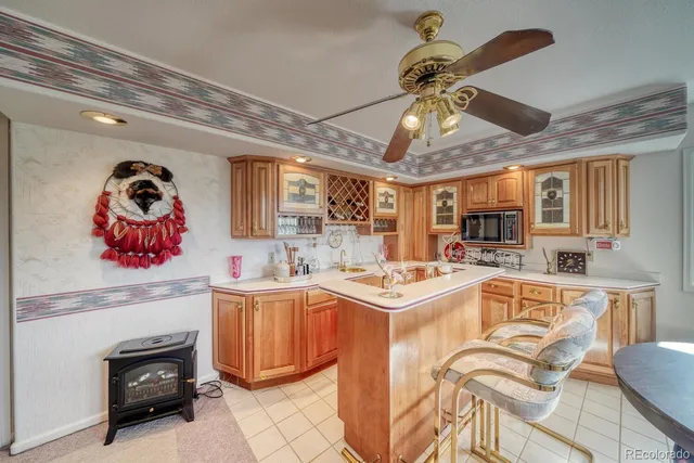 a kitchen that has a lot of cabinets in it