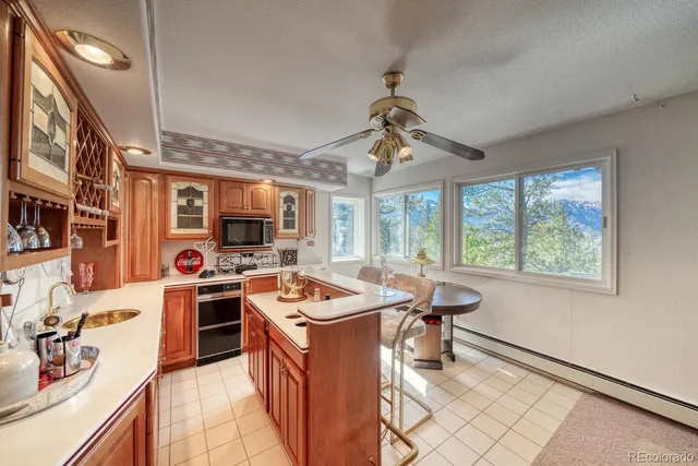 a living room with fireplace furniture and a wooden floor