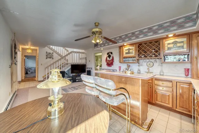 a bedroom with two beds and a chair