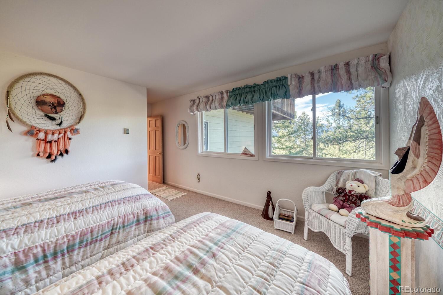 165 Reva Ridge Road Twin Lakes, CO 81251 - Photo 15 of 48 a bedroom with a bed and a window