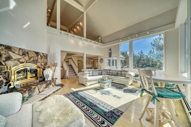 a view of living room with furniture and a chandelier