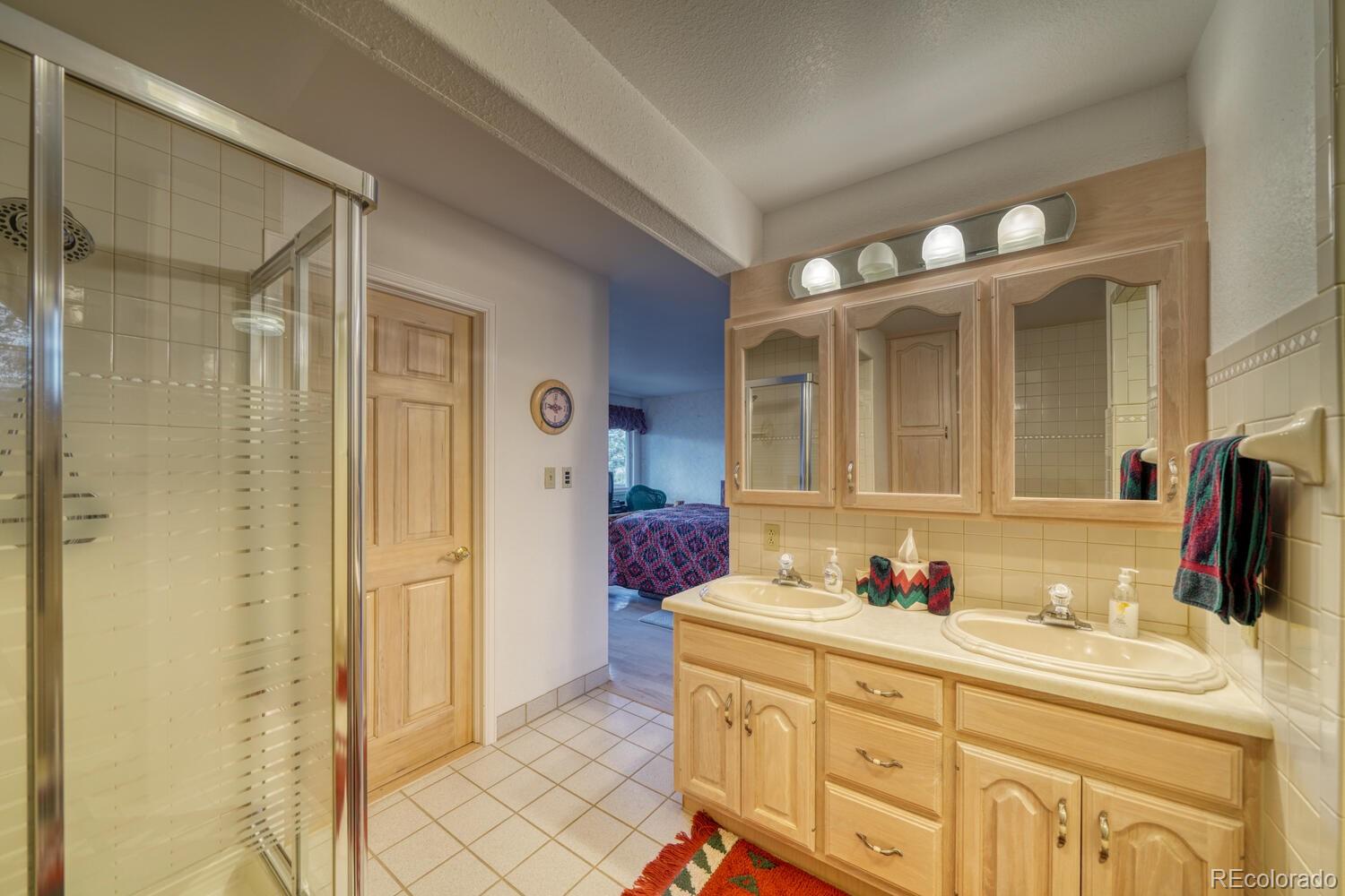 165 Reva Ridge Road Twin Lakes, CO 81251 - Photo 29 of 48 a bathroom with a granite countertop sink mirror and double