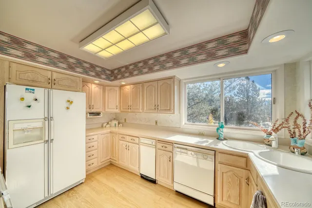 a view of front door with washer and dryer