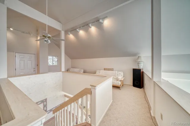 a view of living room with furniture and white walls