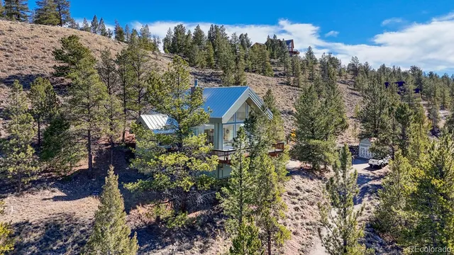 a view of a house with a mountain yard