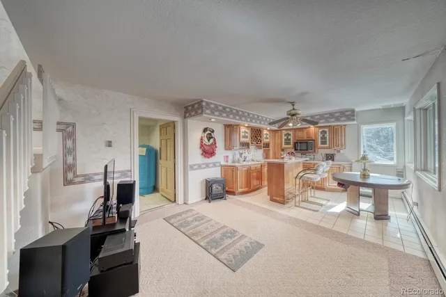 a kitchen with a sink a stove and cabinets