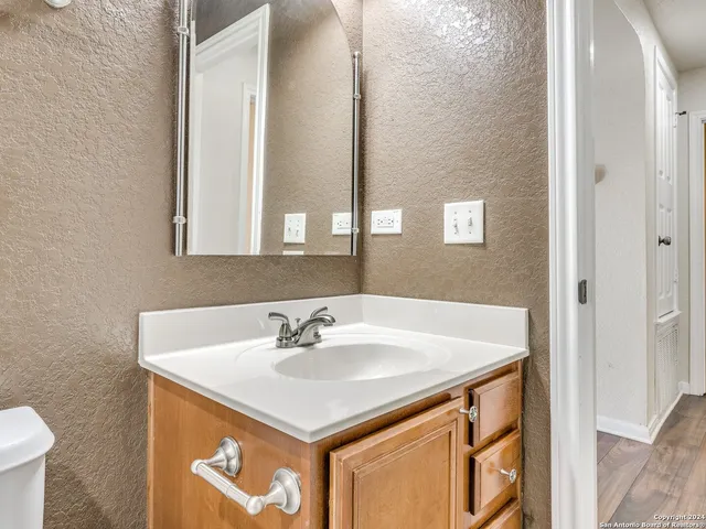 a bathroom with a sink and a mirror
