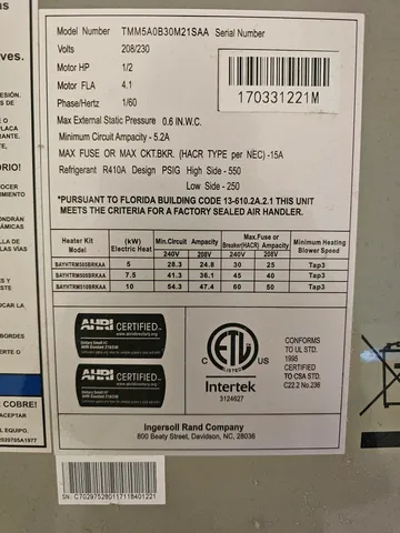 a room with a stove and a wooden floor