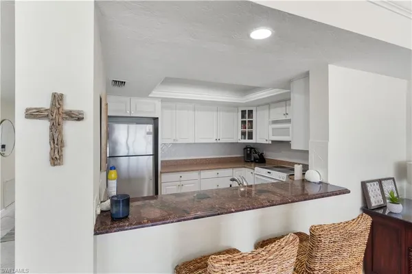 a large bathroom with a tub and a sink