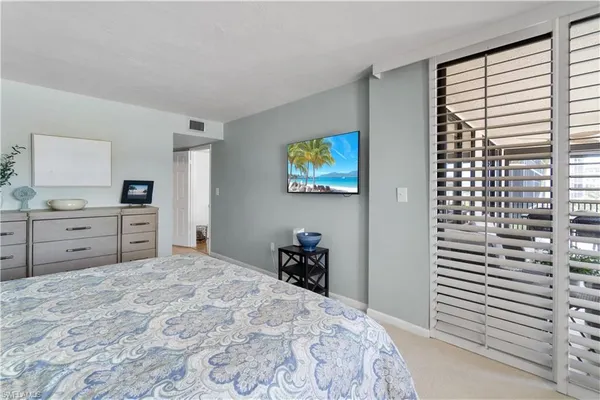 a bedroom with a bed and a cabinets
