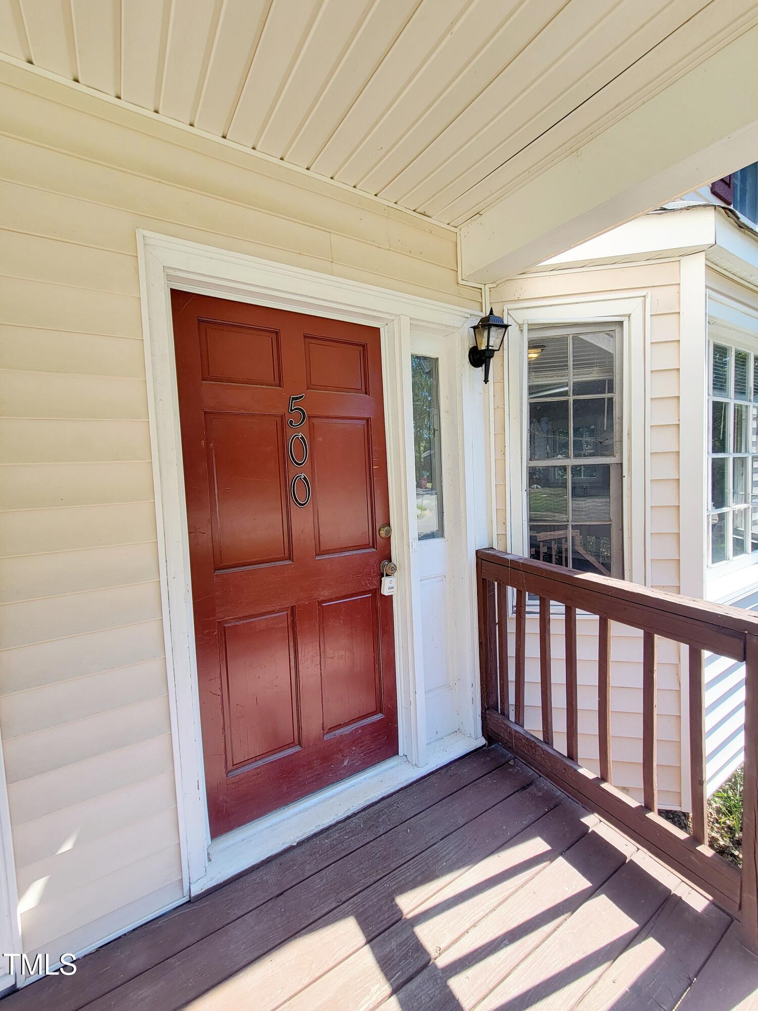 500 Brent Road, Unit 101 Raleigh, NC 27606 - Photo 2 of 62 a view of a porch with wooden floor and fence