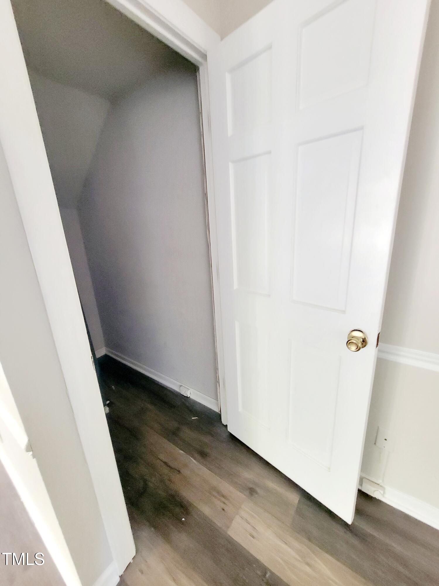 500 Brent Road, Unit 101 Raleigh, NC 27606 - Photo 21 of 62 a view of a hallway with wooden floor