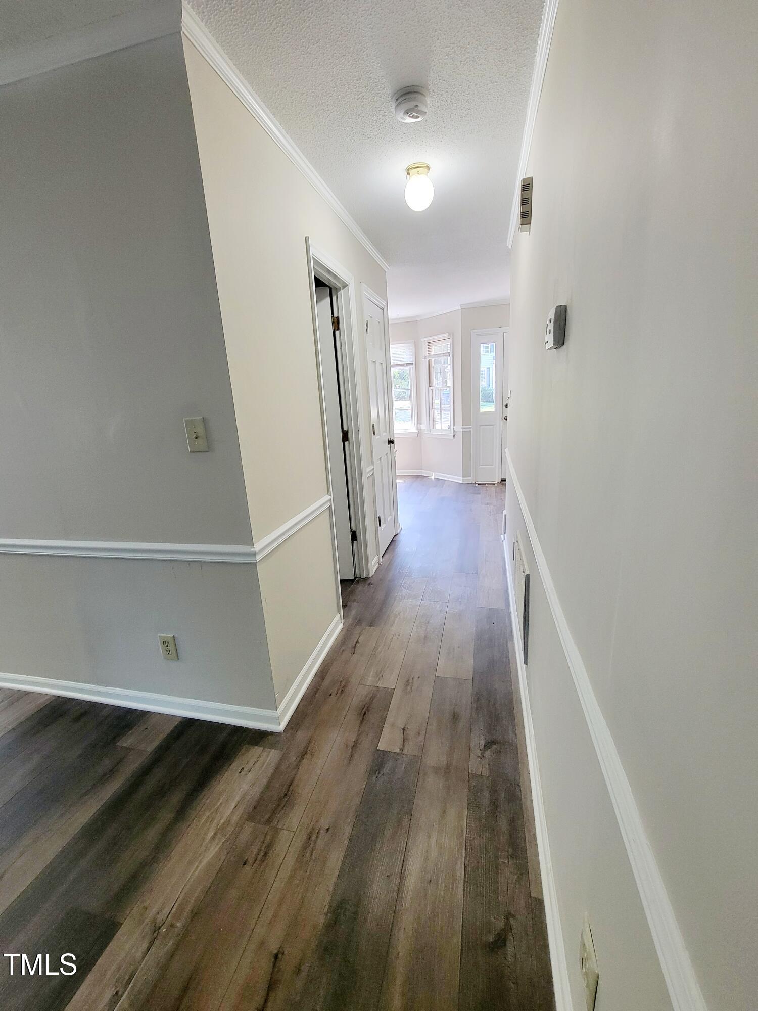 500 Brent Road, Unit 101 Raleigh, NC 27606 - Photo 22 of 62 a view of entryway with wooden floor