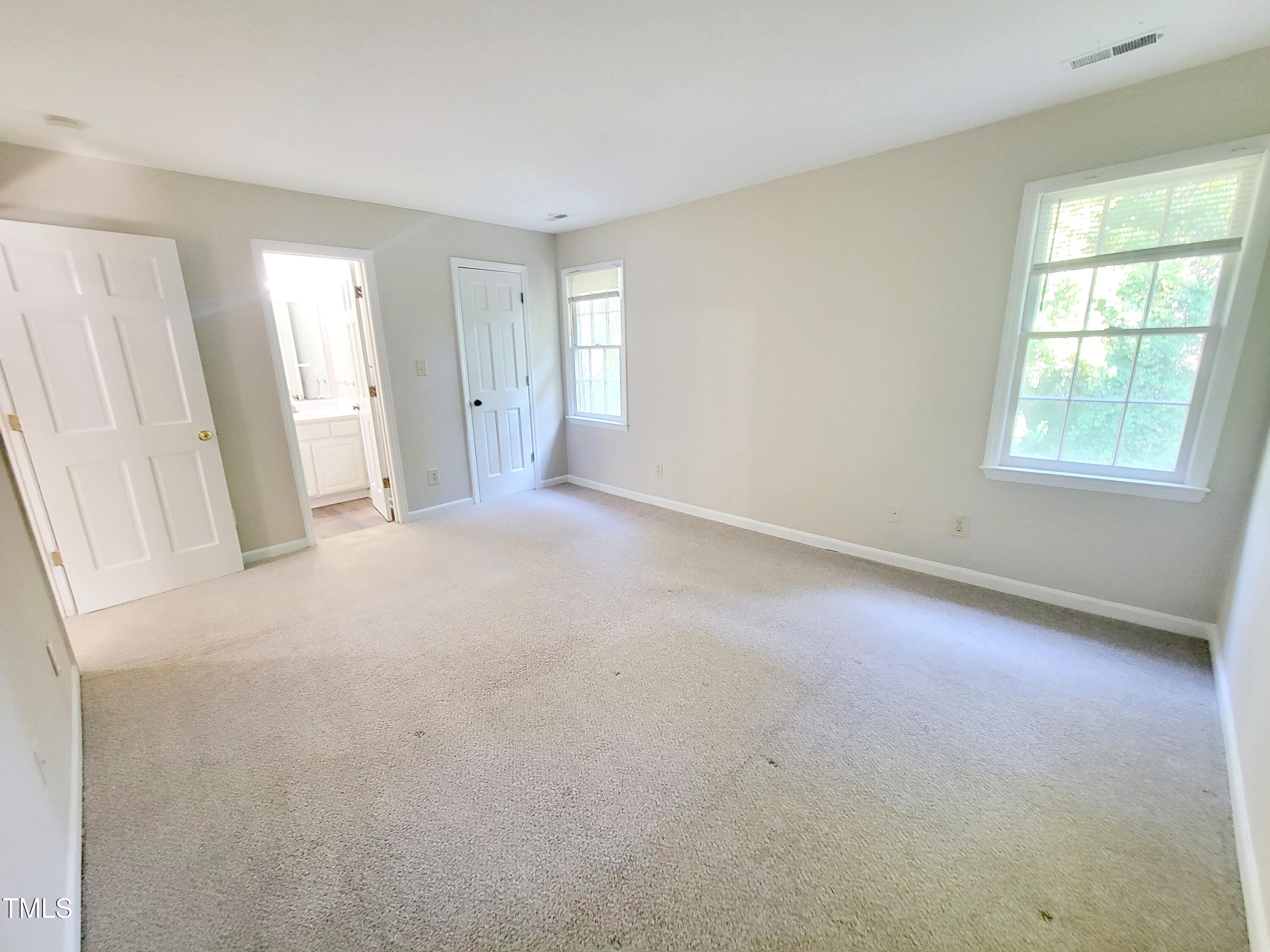 500 Brent Road, Unit 101 Raleigh, NC 27606 - Photo 29 of 62 an empty room with windows