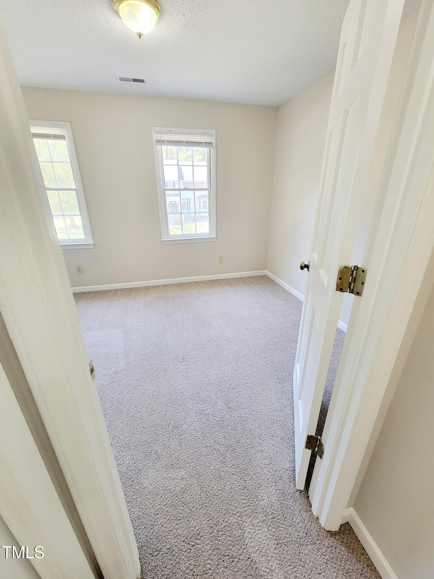 500 Brent Road, Unit 101 Raleigh, NC 27606 - Photo 38 of 62 a view of a livingroom with a staircase