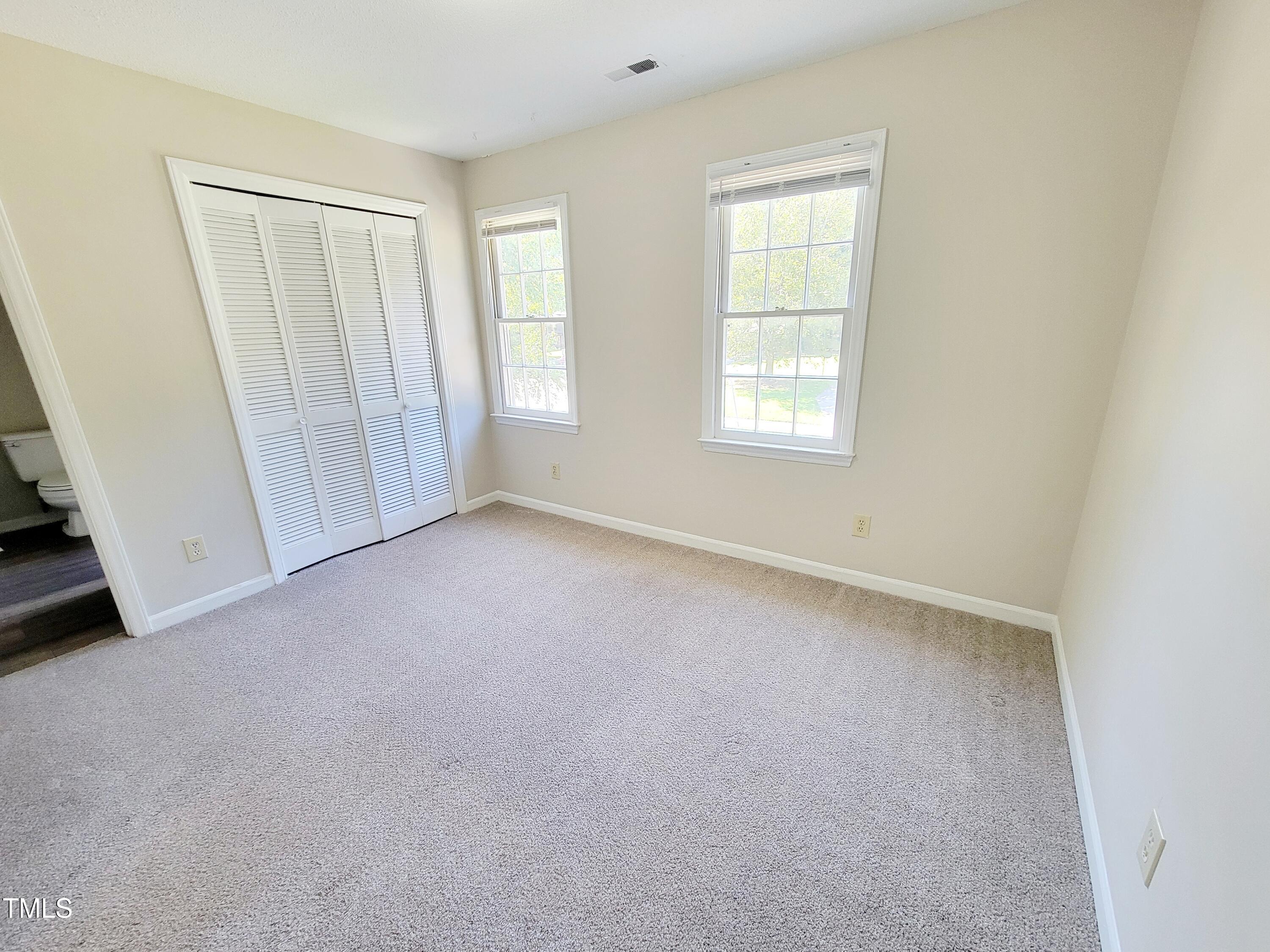 500 Brent Road, Unit 101 Raleigh, NC 27606 - Photo 39 of 62 an empty room with windows