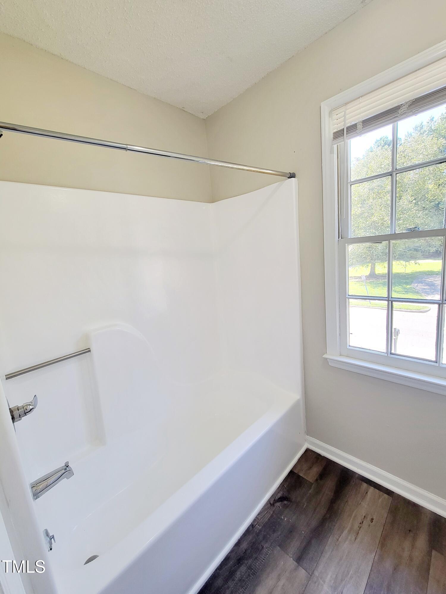500 Brent Road, Unit 101 Raleigh, NC 27606 - Photo 46 of 62 a view of a small space with wooden floor and a window