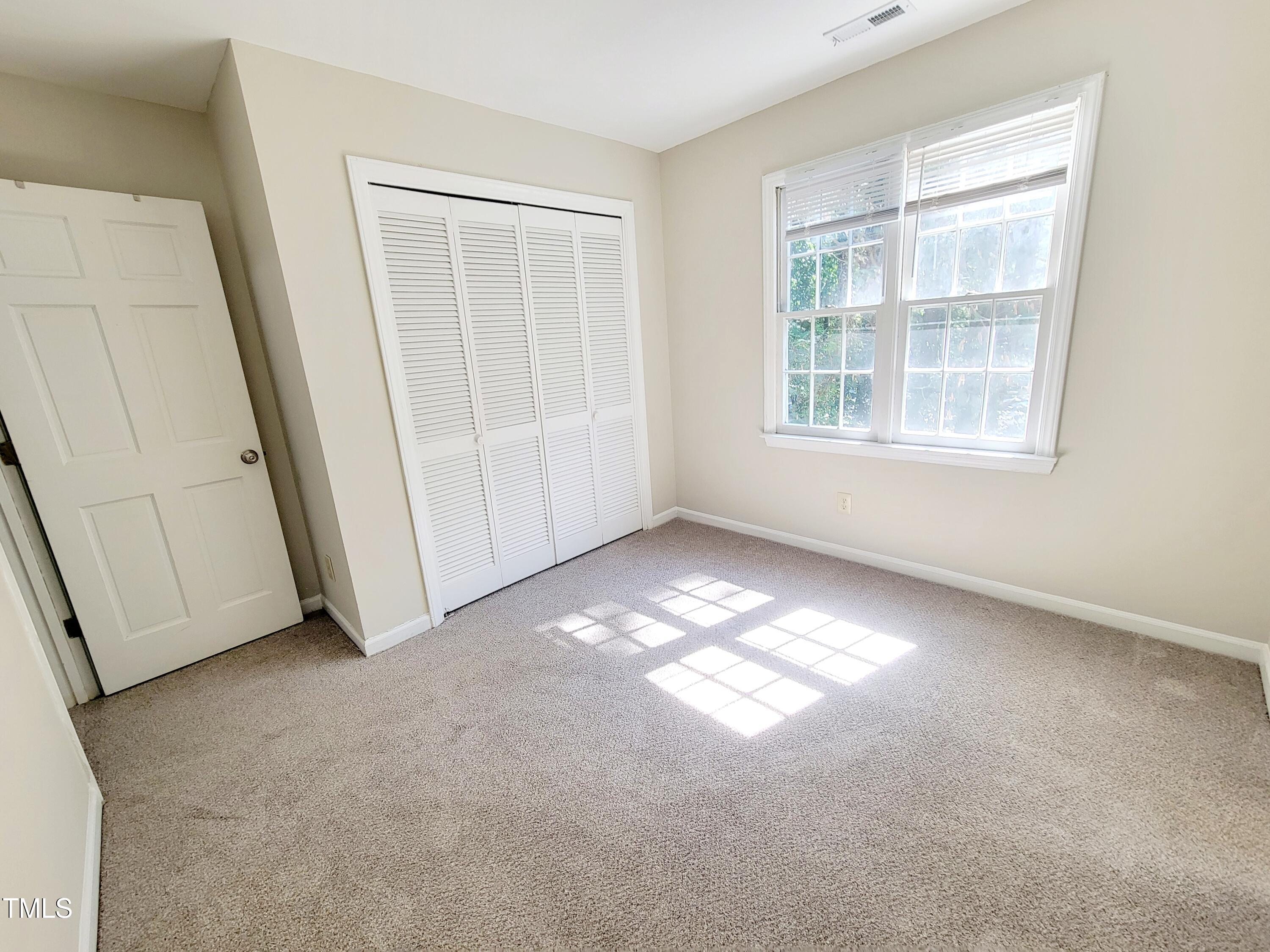 500 Brent Road, Unit 101 Raleigh, NC 27606 - Photo 49 of 62 an empty room with windows
