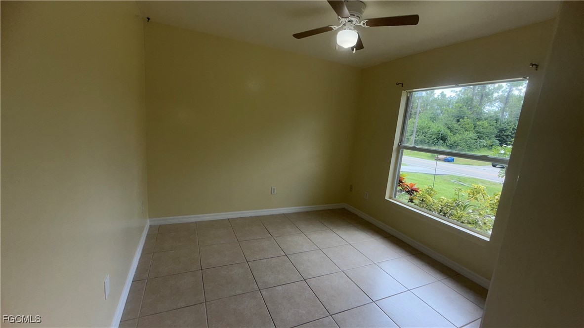 414 East 12th Street Lehigh Acres, FL 33972 - Photo 8 of 9 an empty room with a window