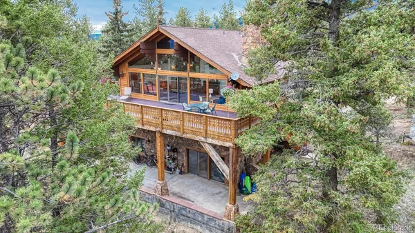 a house with trees in the background