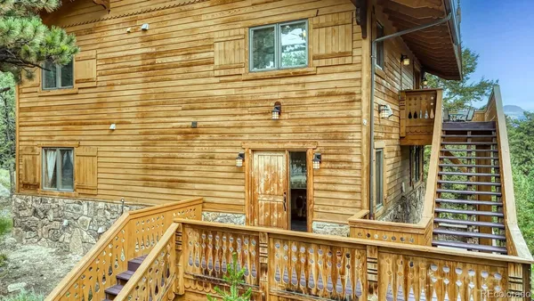 a view of a brick house with a large window