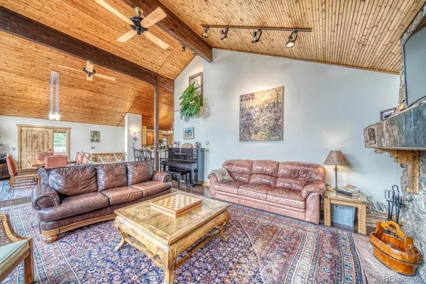 a living room with furniture and a rug