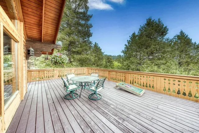 a view of balcony with furniture and wooden floor