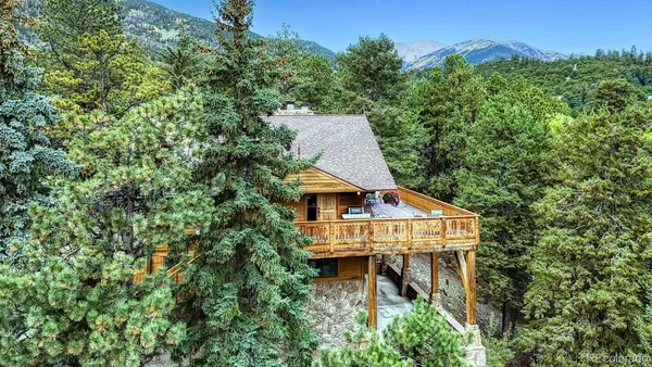 an aerial view of a house with a yard