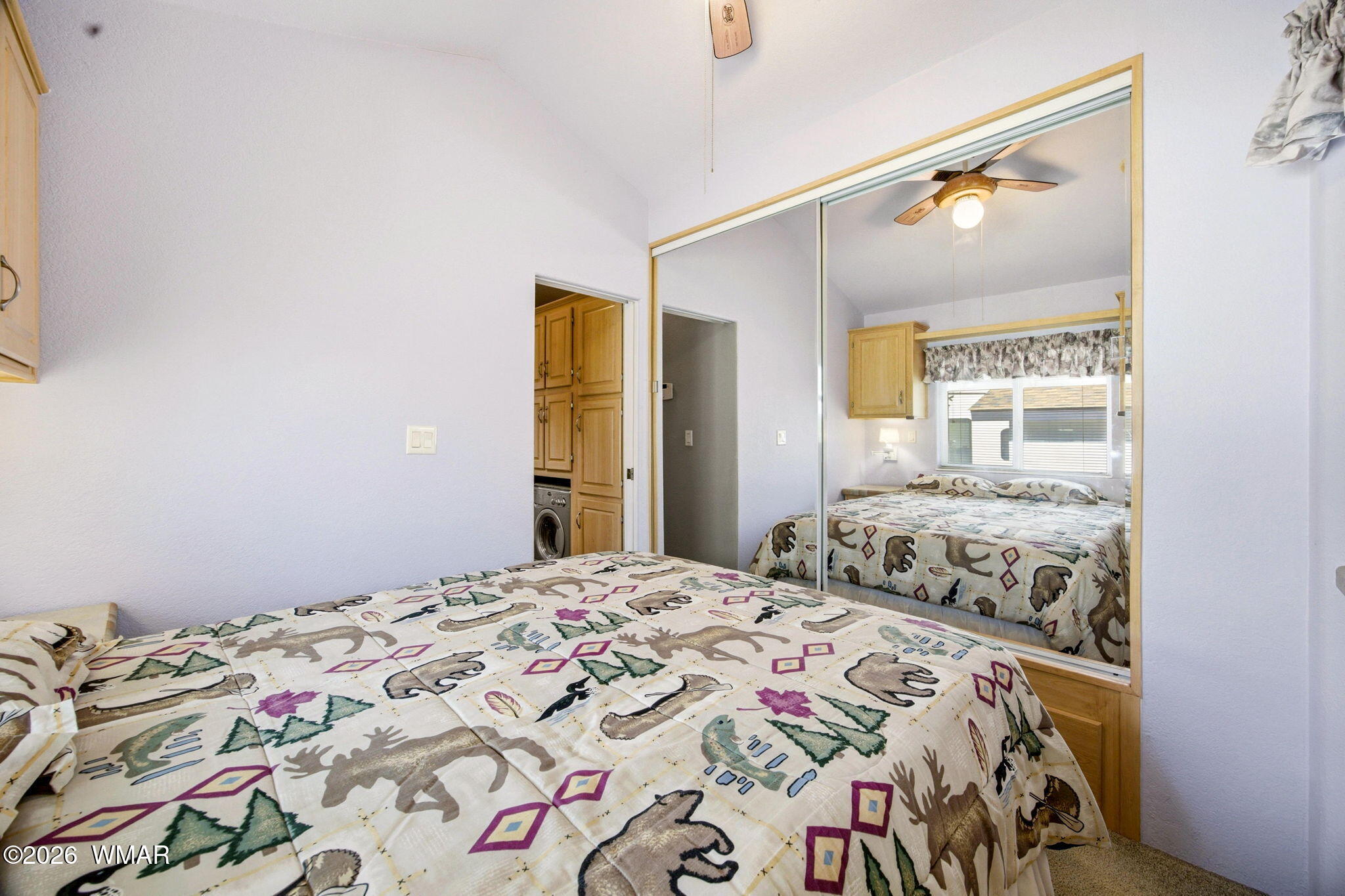 2275 Old Crooks Trail Overgaard, AZ 85933 - Photo 15 of 24 a bedroom with a bed and a window