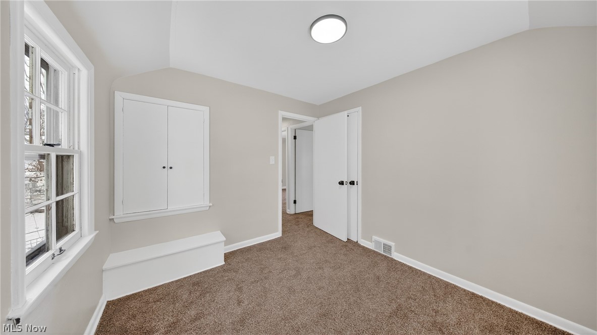 16811 Invermere Avenue Cleveland, OH 44128 - Photo 38 of 47 Unfurnished bedroom featuring lofted ceiling and carpet floors