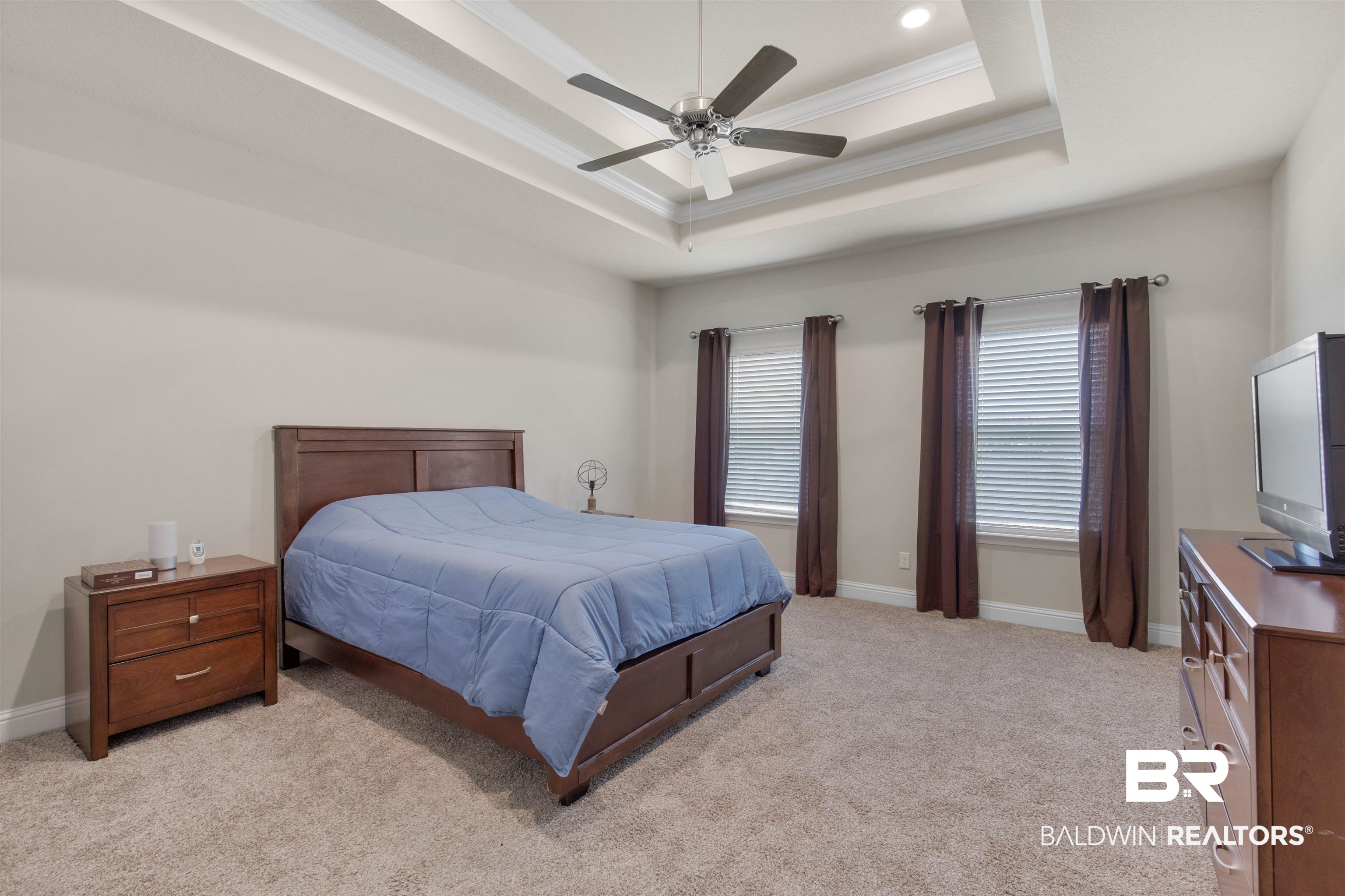 2345 Laurel Street Semmes, AL 36575 - Photo 12 of 31 Bedroom with a tray ceiling, light colored carpet, crown molding, ceiling fan, and recessed lighting