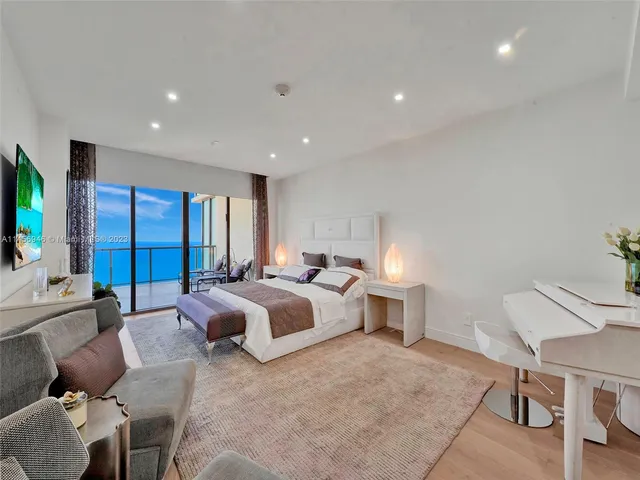 a bed room with a bed window and a chair