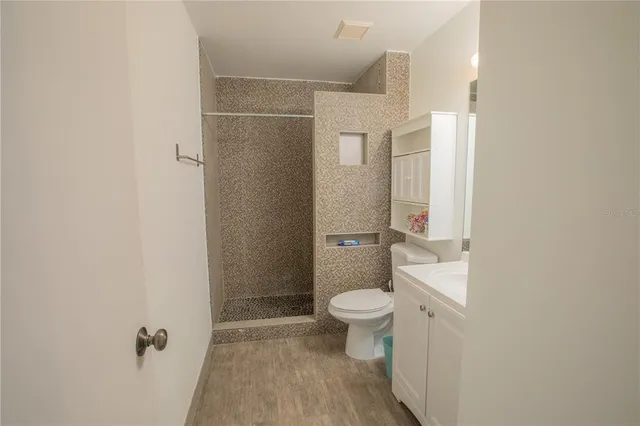 a bathroom with a sink vanity and a mirror
