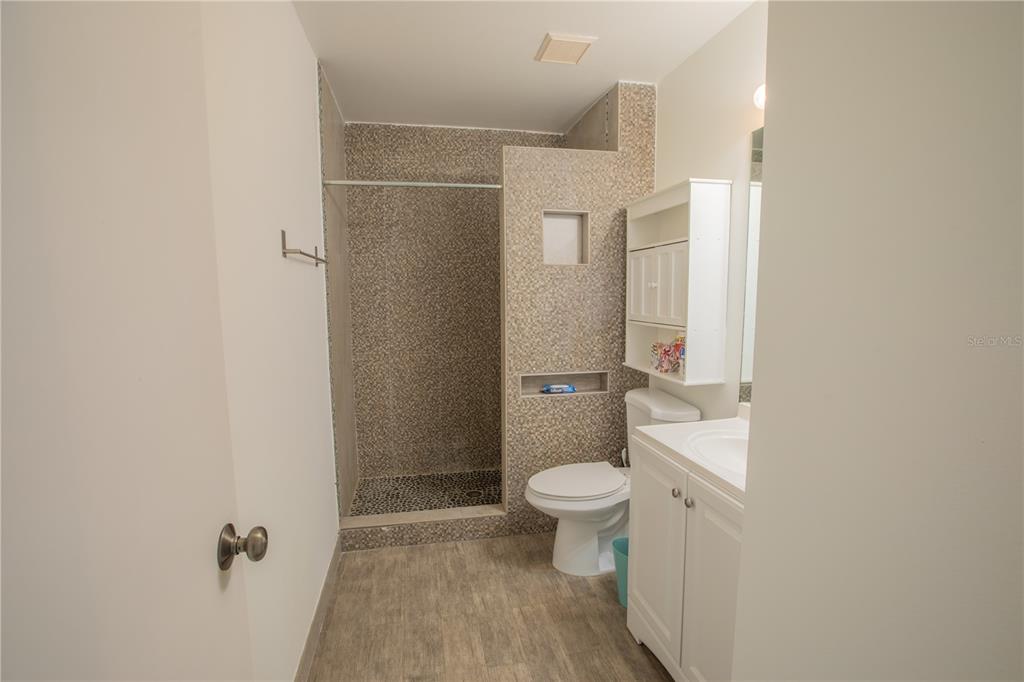 1711 Southwest 116th Way Miramar, FL 33025 - Photo 20 of 33 a bathroom with a toilet sink and a mirror