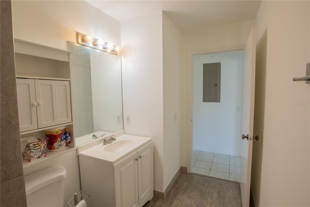1711 Southwest 116th Way Miramar, FL 33025 - Photo 21 of 33 a bathroom with a sink vanity and a mirror