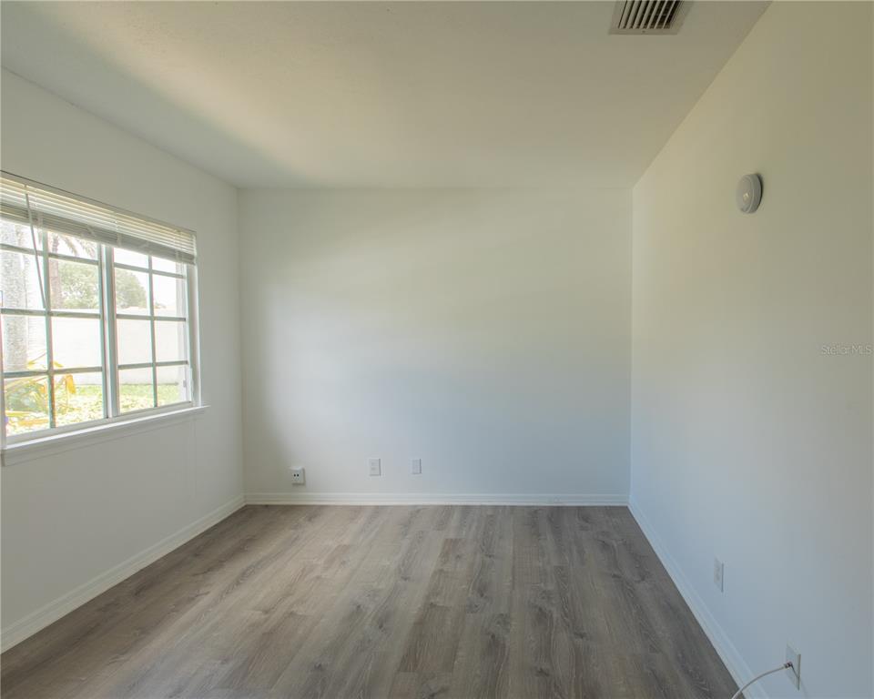 1711 Southwest 116th Way Miramar, FL 33025 - Photo 23 of 33 an empty room with a window