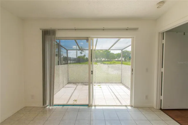 a view of a room with wooden floor and fence