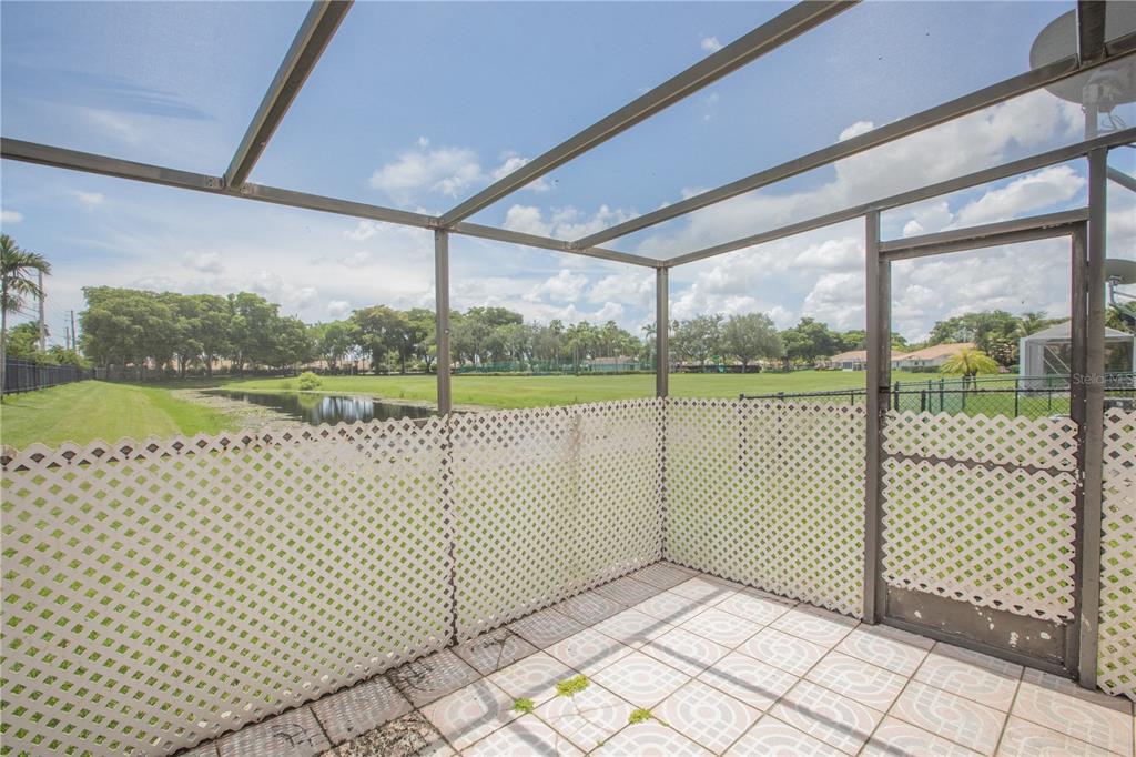 1711 Southwest 116th Way Miramar, FL 33025 - Photo 26 of 33 a view of a room with wooden floor and fence