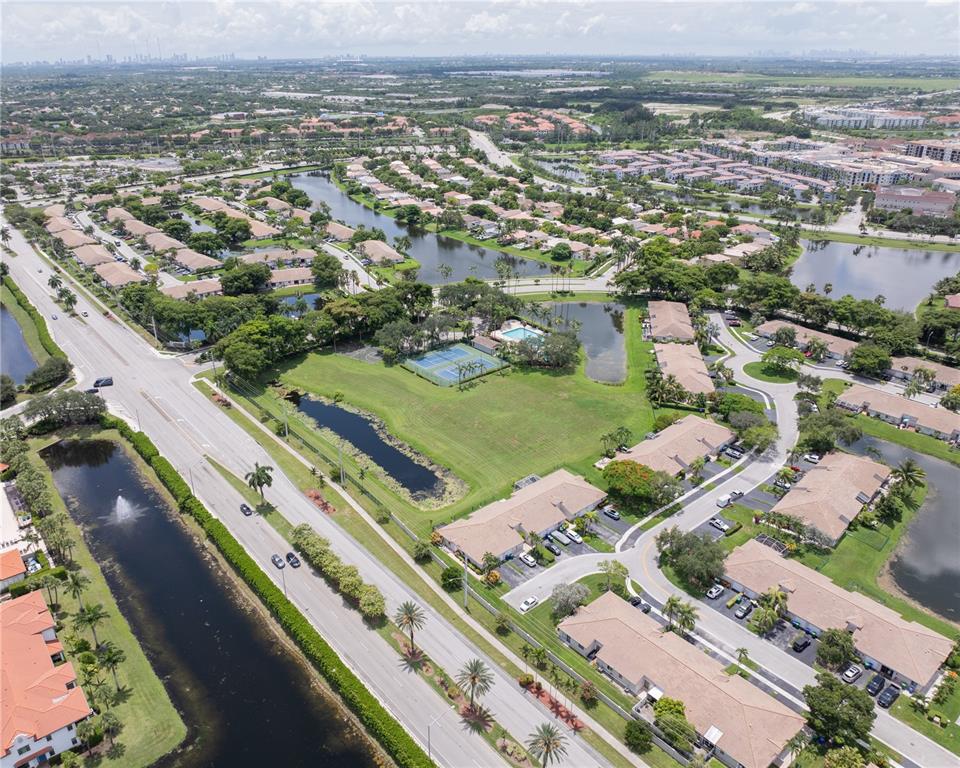 1711 Southwest 116th Way Miramar, FL 33025 - Photo 29 of 33 an aerial view of residential houses with outdoor space