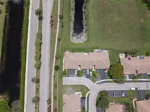 an aerial view of residential building with parking space