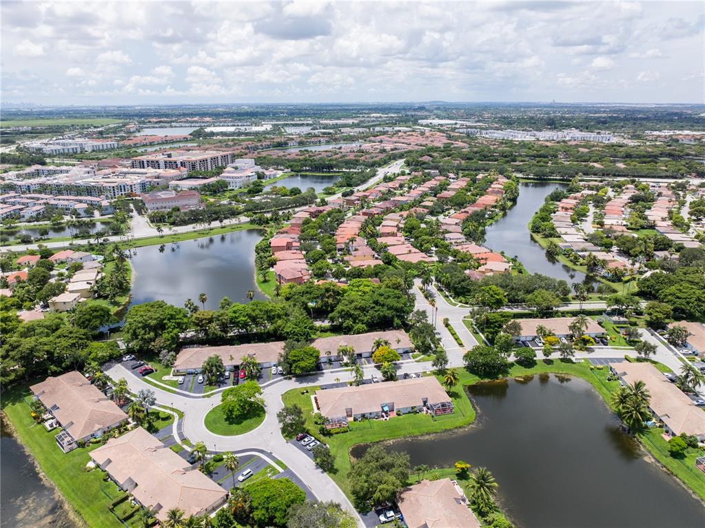 1711 Southwest 116th Way Miramar, FL 33025 - Photo 32 of 33 an aerial view of residential houses with outdoor space